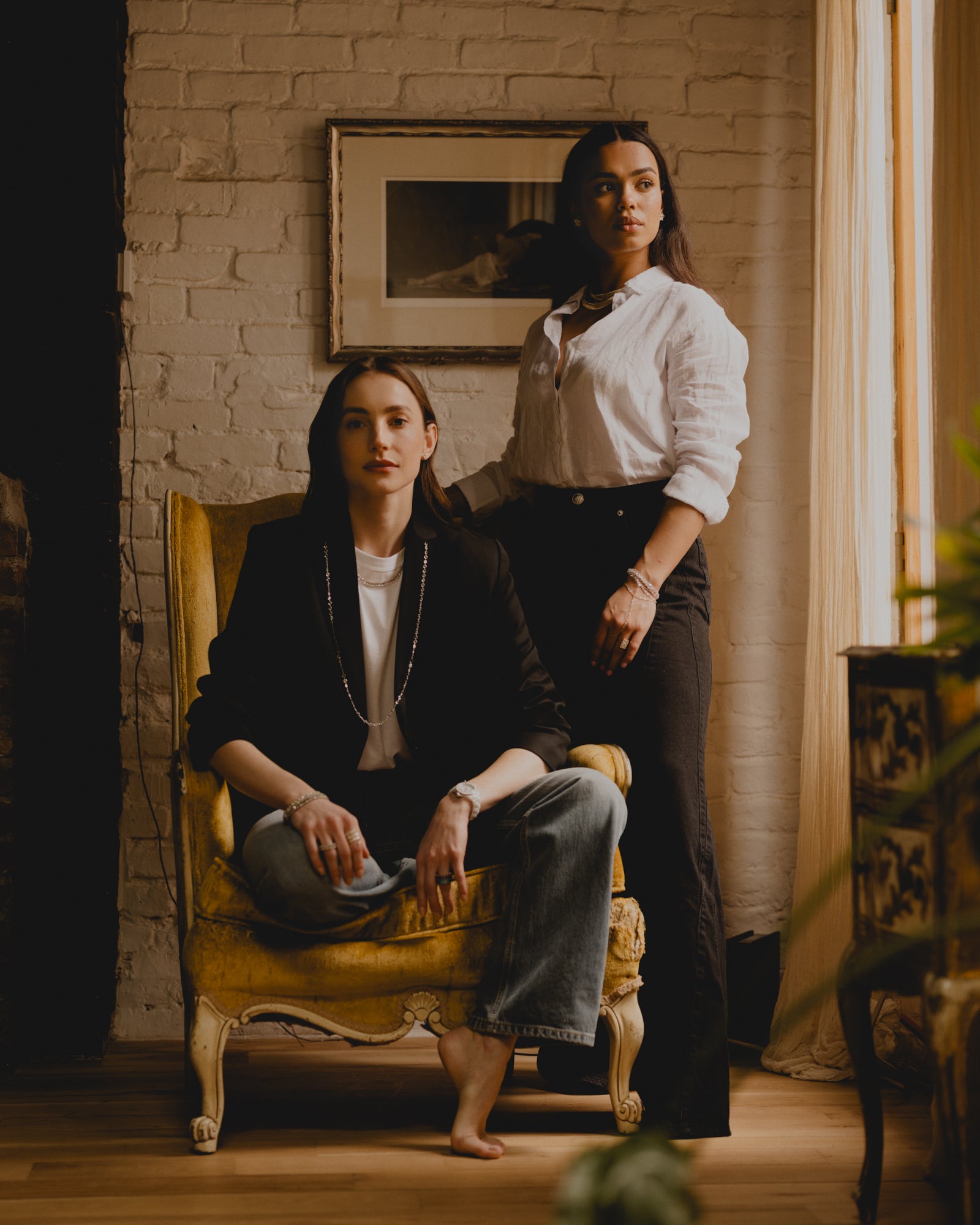 Two Beautiful Women wearing Eleuthera Zo Jewelry. 18K White Gold Necklace with Rose Cut Natural Mined Diamonds.