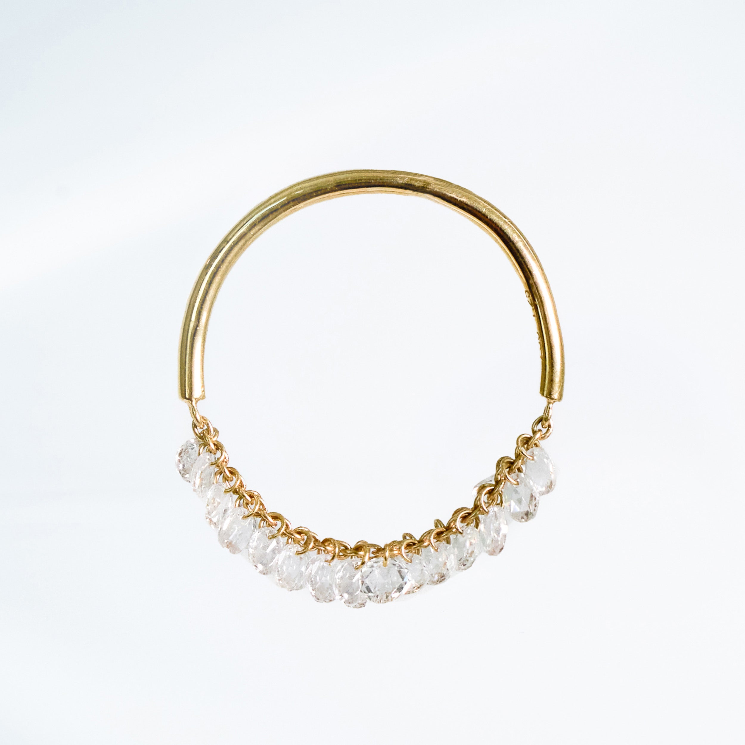 Gold ring with small diamonds on a white background. Rose cut dimaonds on 18k gold chain.
