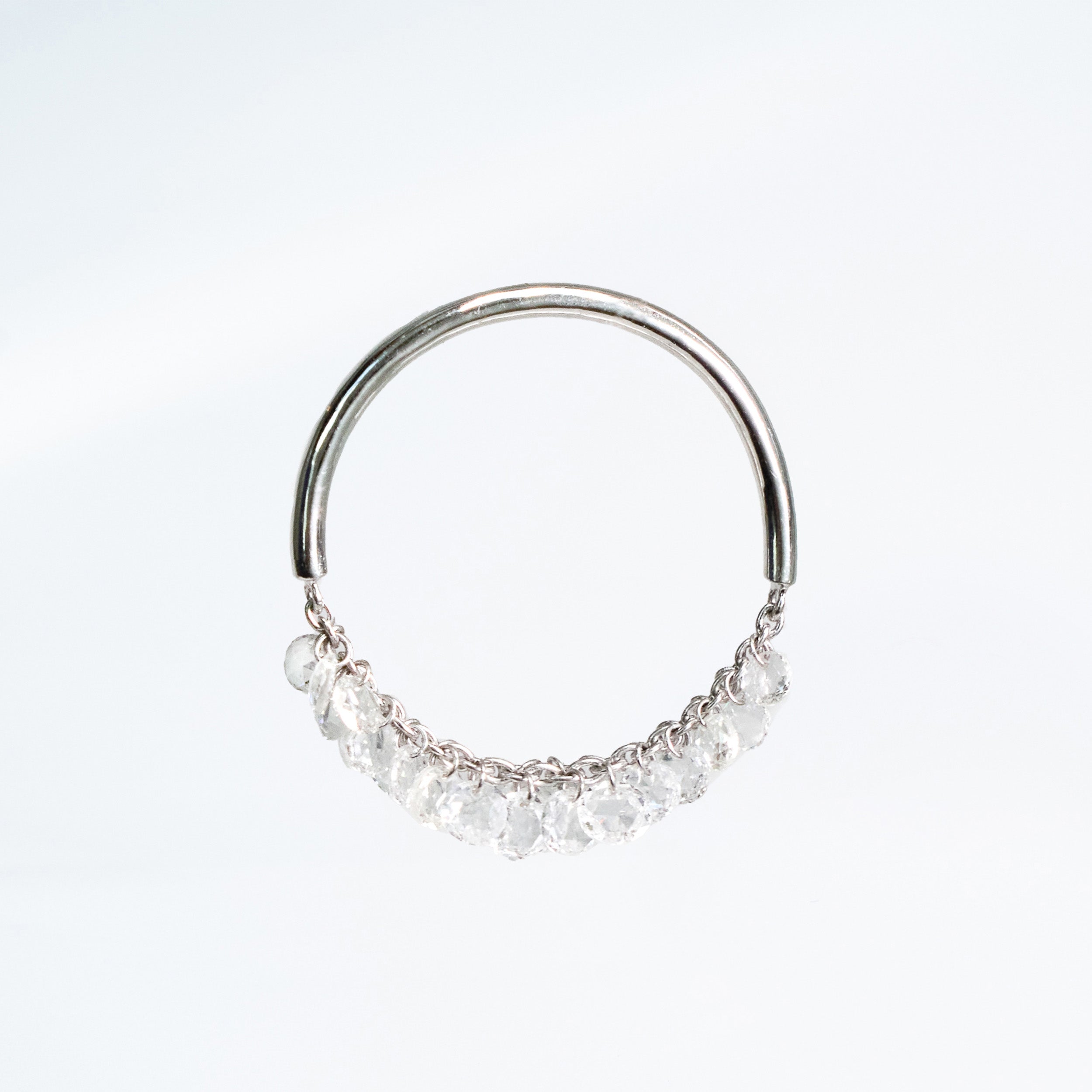 Gold ring with small diamonds on a white background. Rose cut dimaonds on 18k gold chain.