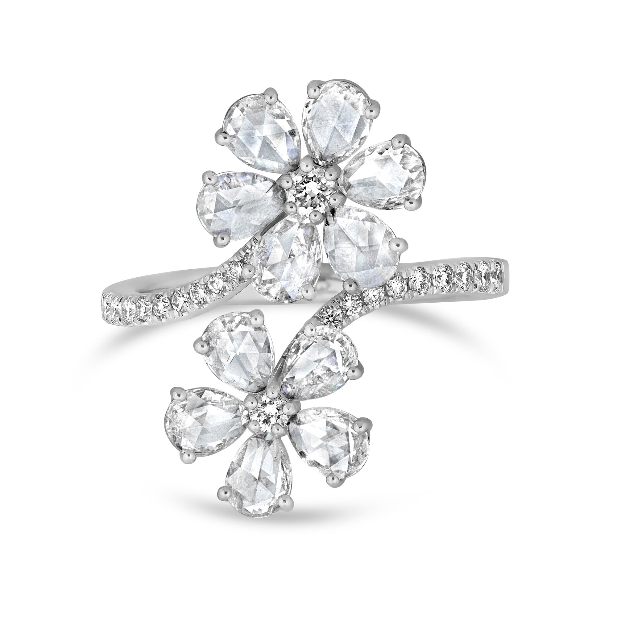 Two flowers made out of rose cut natural mined diamonds set in 14k white gold with diamonds on the band around the flowers.