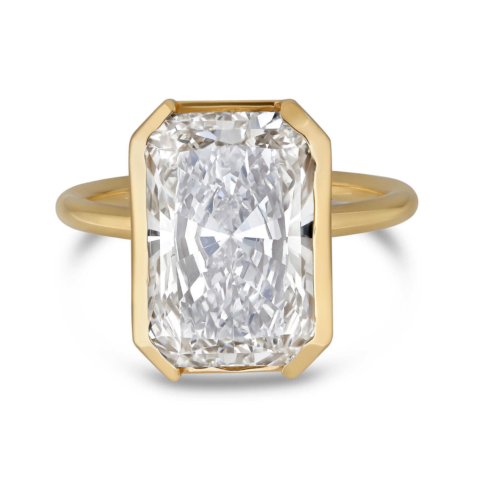 8 carat radiant cut lab dimaond set in 14k yellow gold bezel set ring.