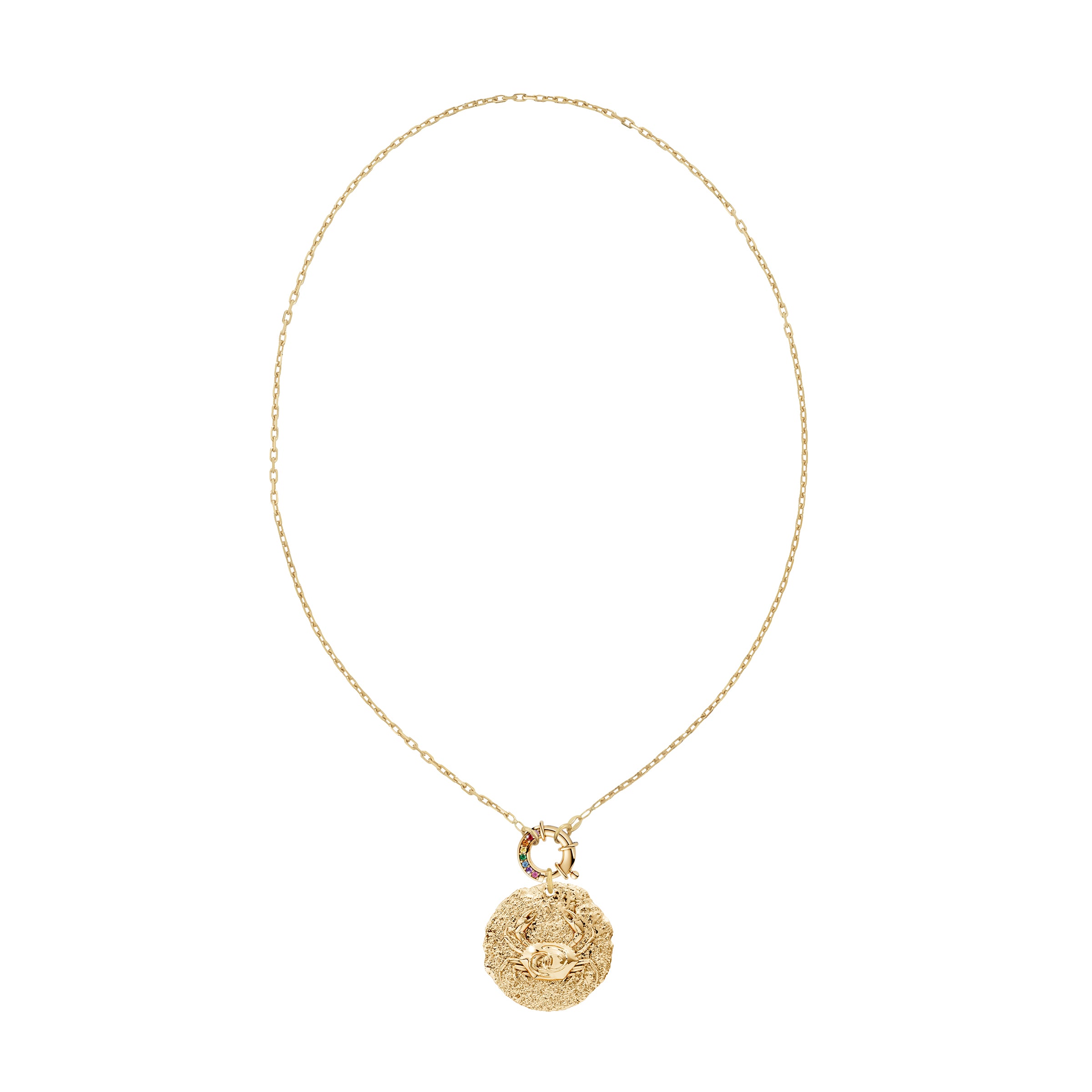 Gold necklace with a round zodiac cancer pendant with crab design on rainbow sapphire decorative clasp on a white background