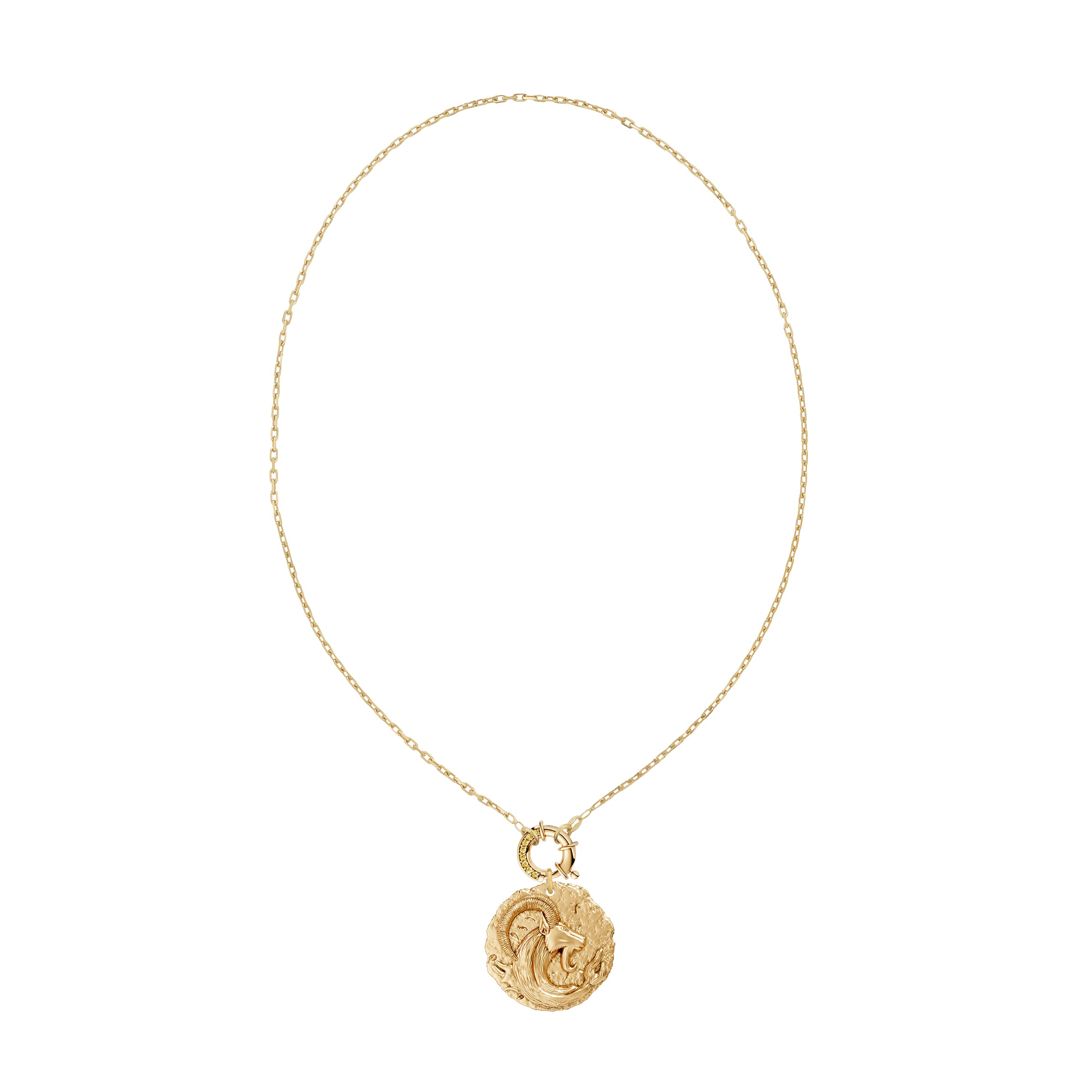 Gold necklace with a circular zodiac Capricorn pendant on a small link chain and a yellow diamond clasp on a white background