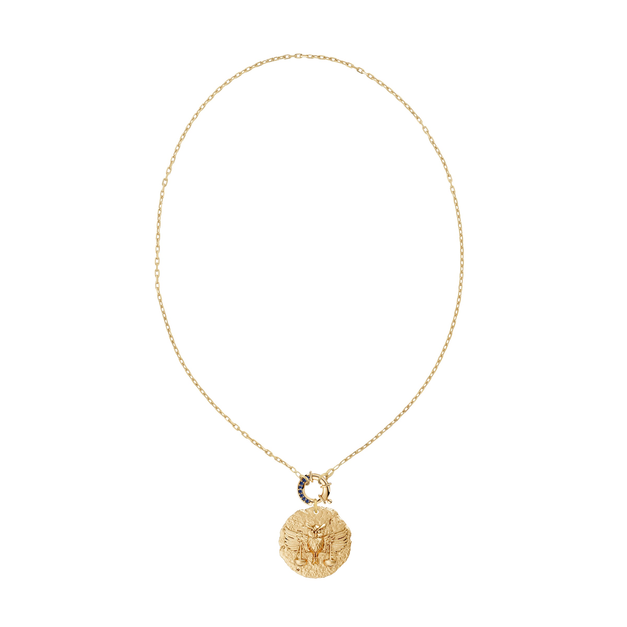 Gold necklace with a round zodiac libra pendant on link chain with decorative blue sapphire clasp on a white background
