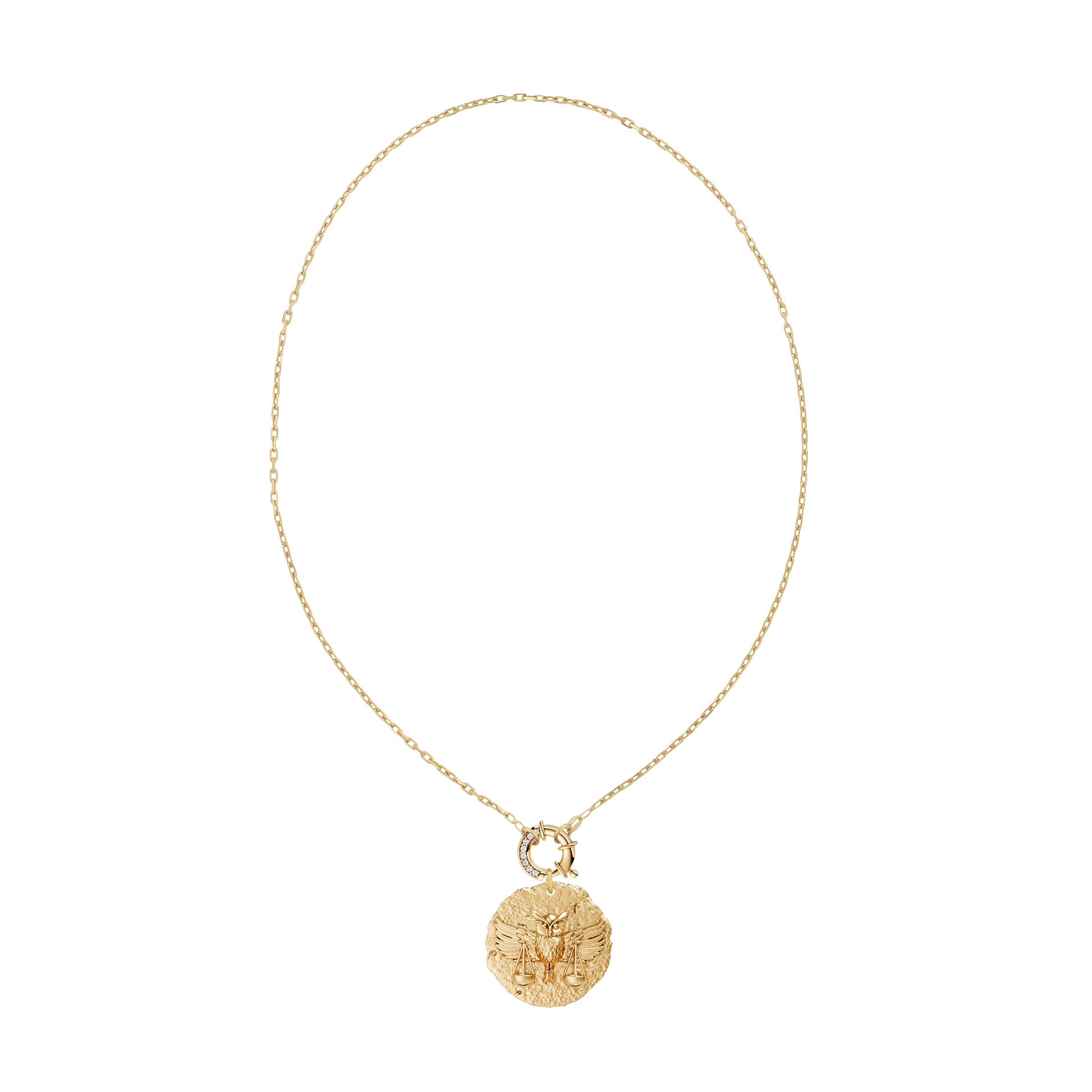 Gold necklace with a round zodiac libra pendant on link chain with decorative white diamond clasp on a white background
