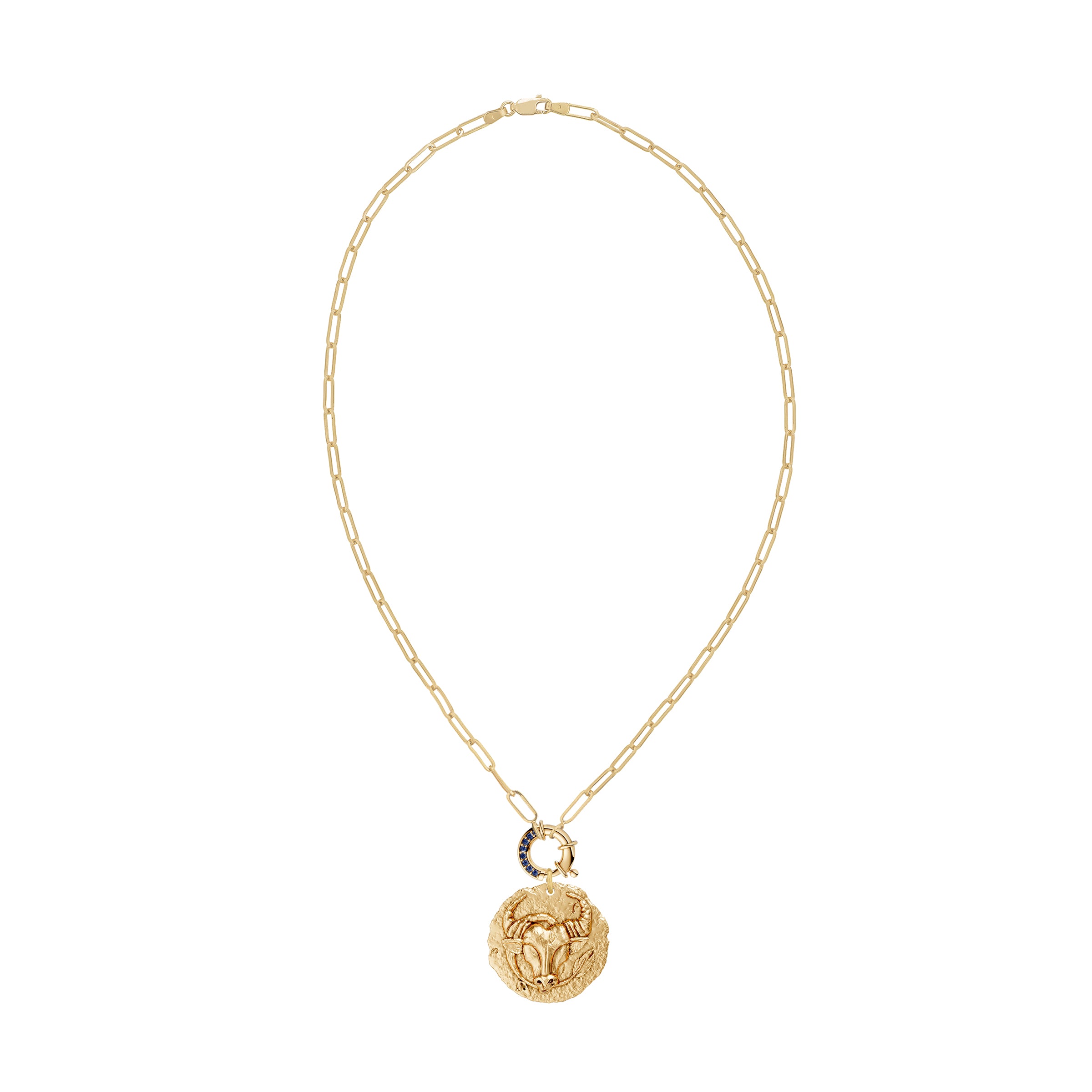 Gold necklace with a taurus zodiac pendant and a blue sapphire decorative clasp on a white background