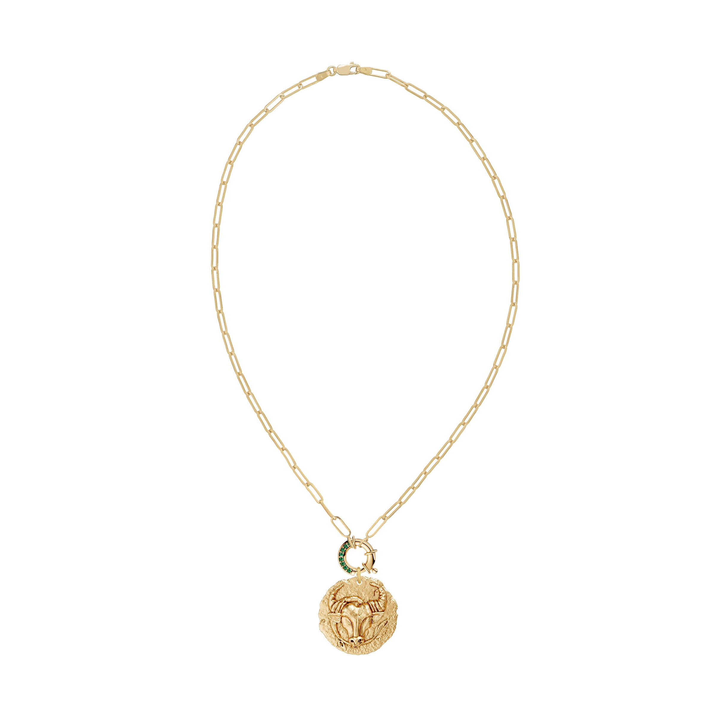 Gold necklace with a taurus zodiac pendant and a emerald decorative clasp on a white background