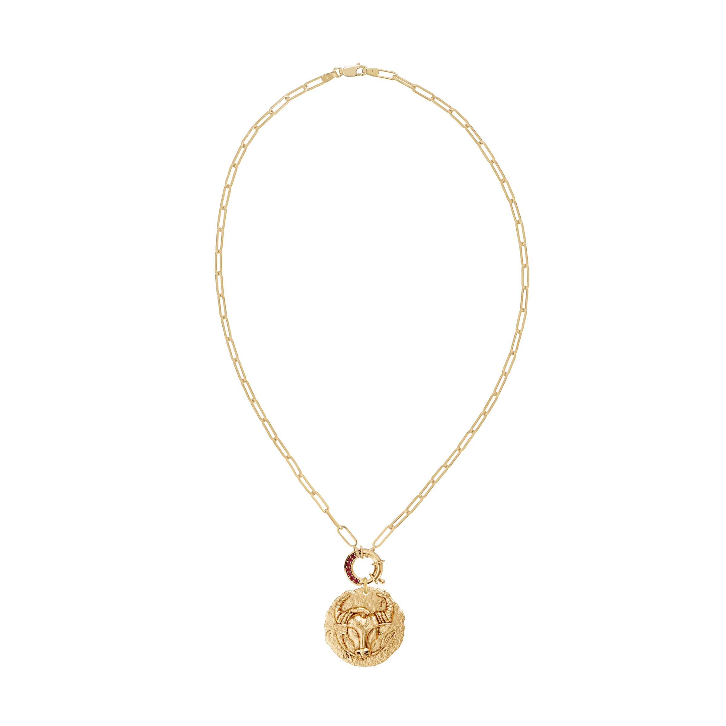 Gold necklace with a taurus zodiac pendant and a ruby decorative clasp on a white background