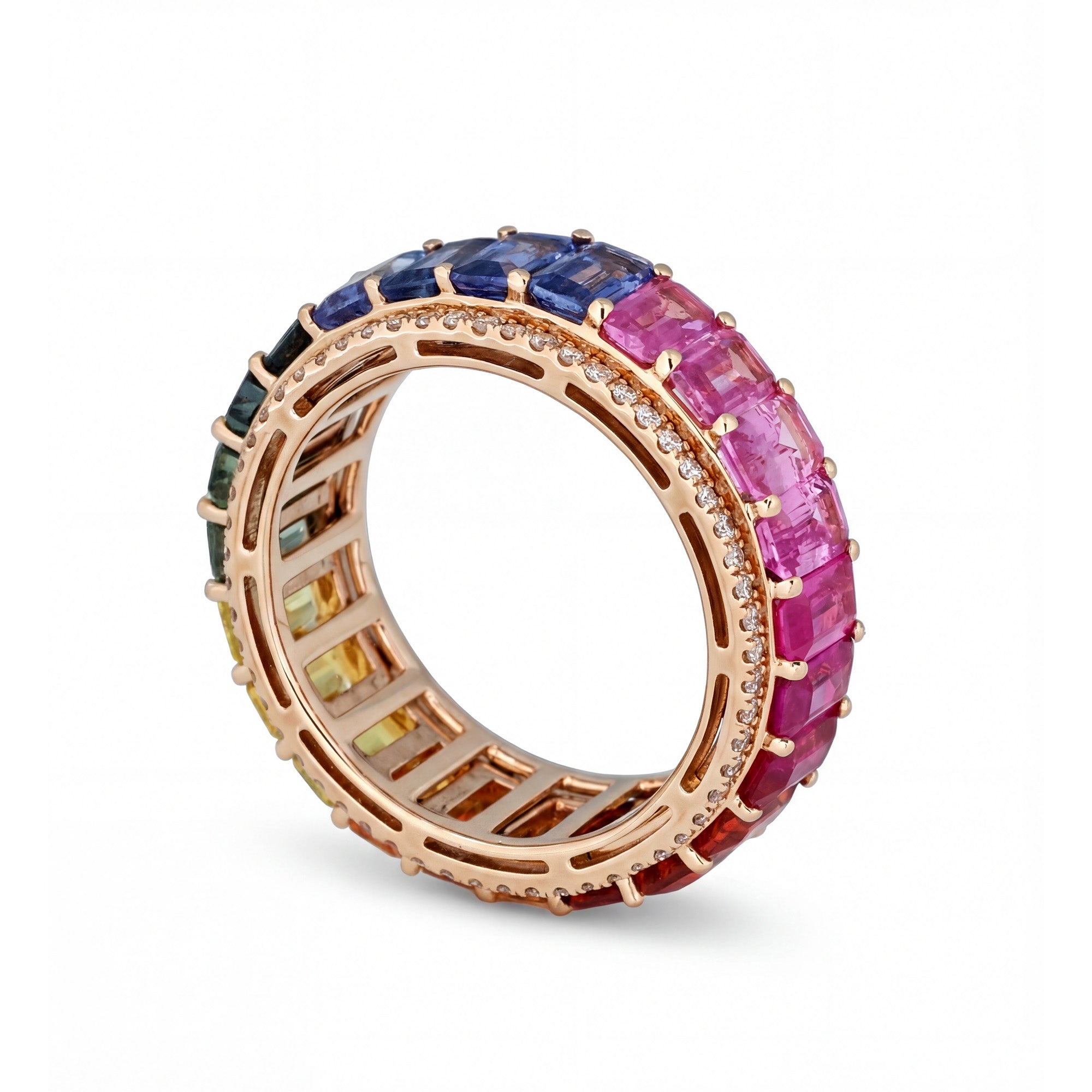 Multicolored gemstone ring with rose gold band on a white background