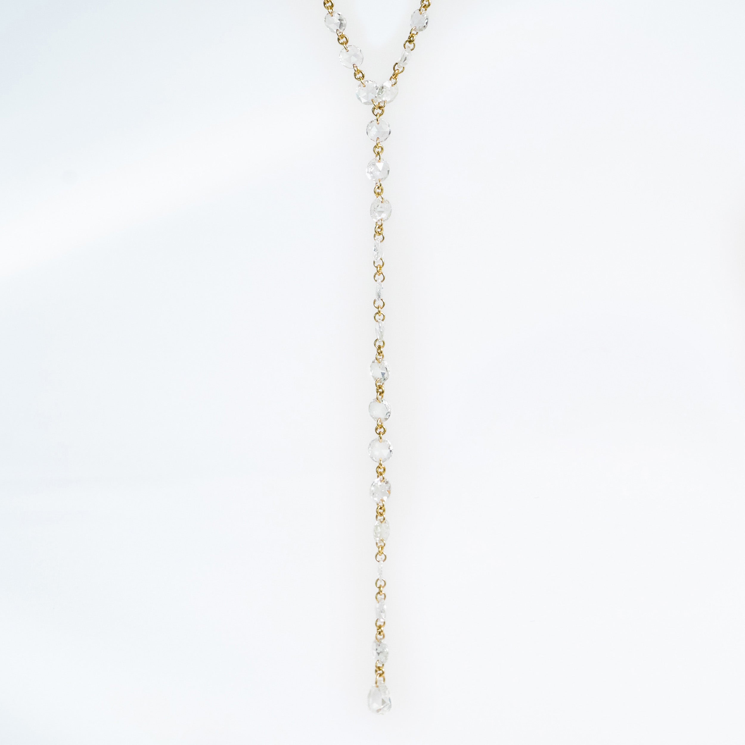 Details of Rose Cut Diamond lariat set in 18k gold 