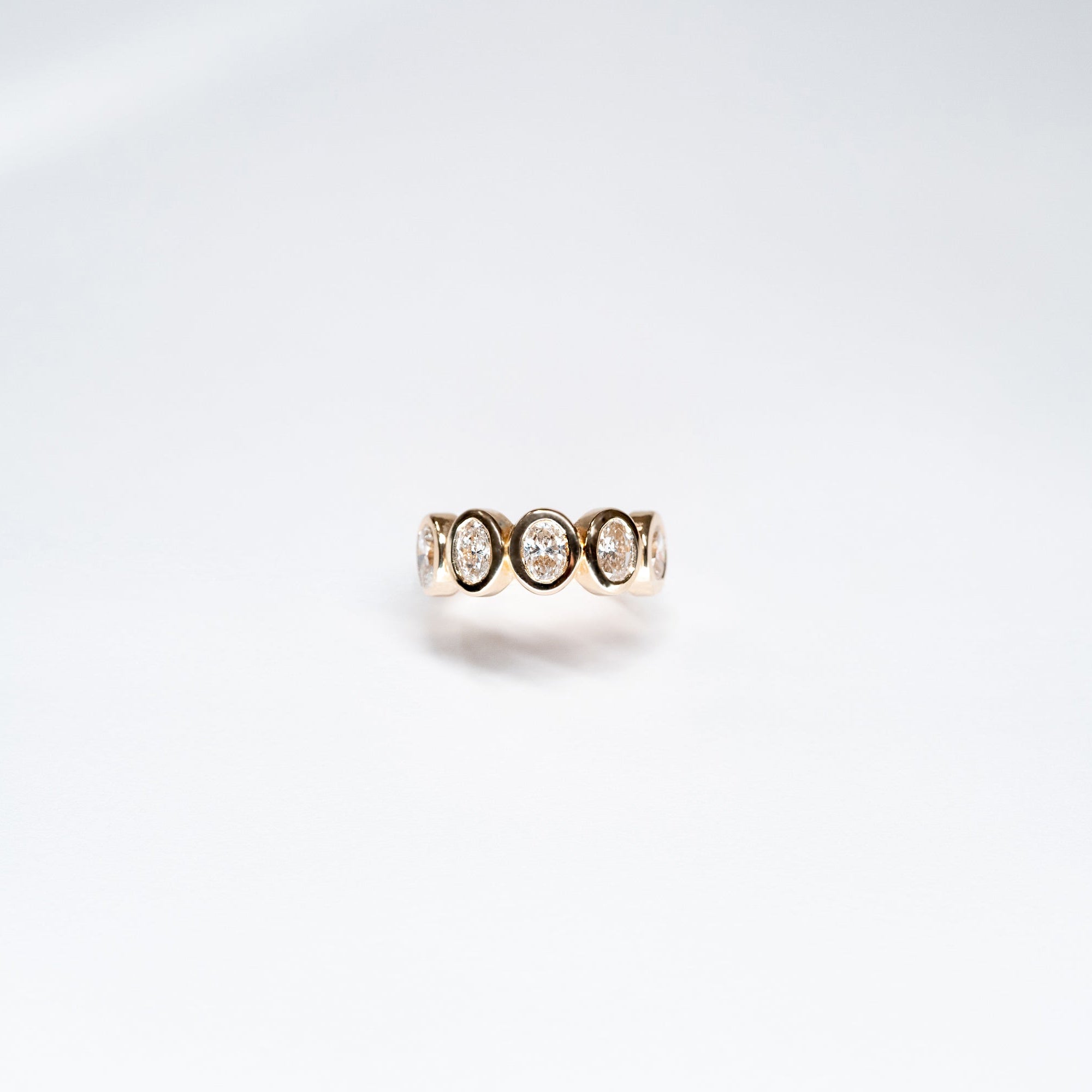 Five Oval Lab Diamond Ring set in 14k Yellow Gold. All oval diamonds are the same carat weight.