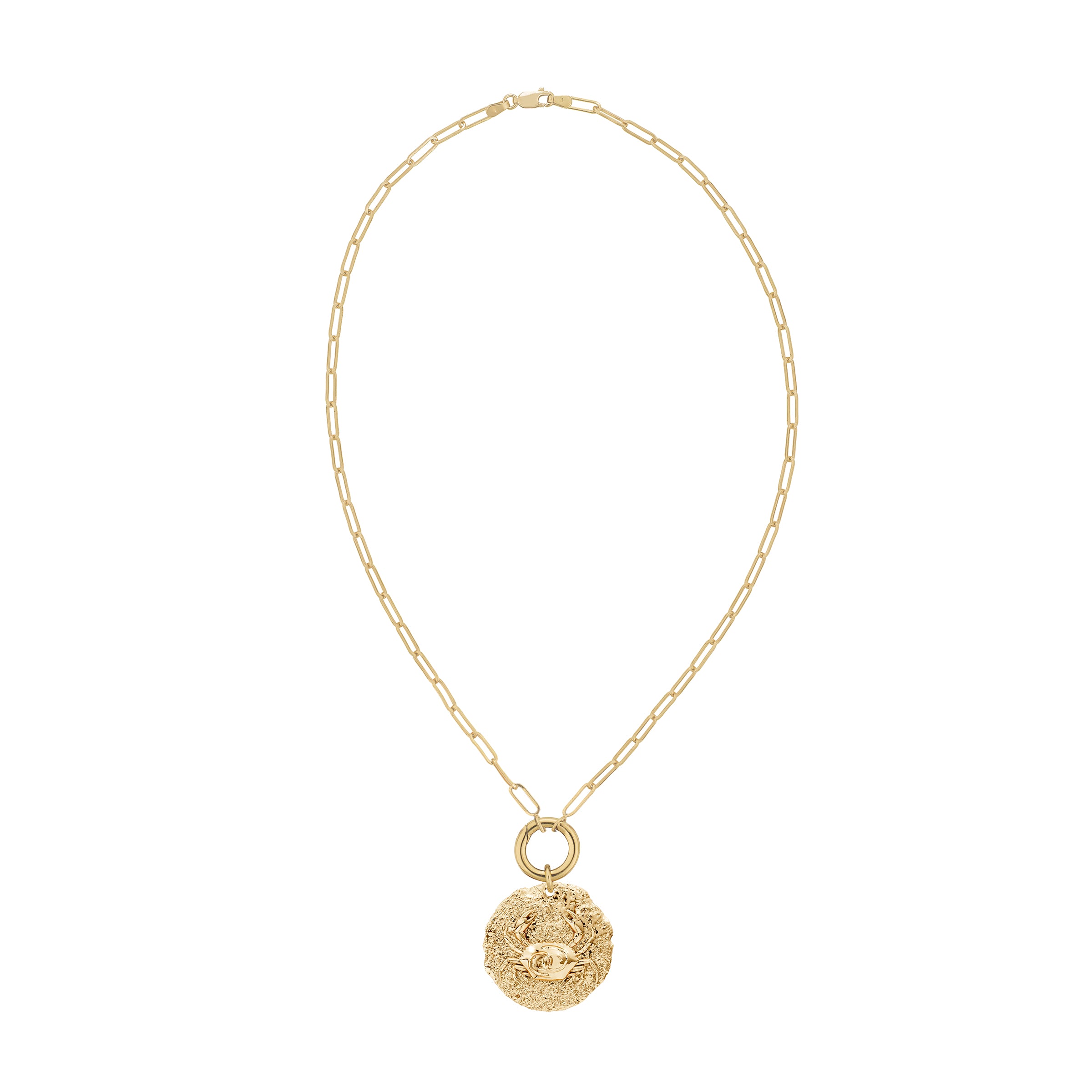 Gold necklace with a round zodiac cancer pendant with crab design on solid gold decorative clasp on a white background