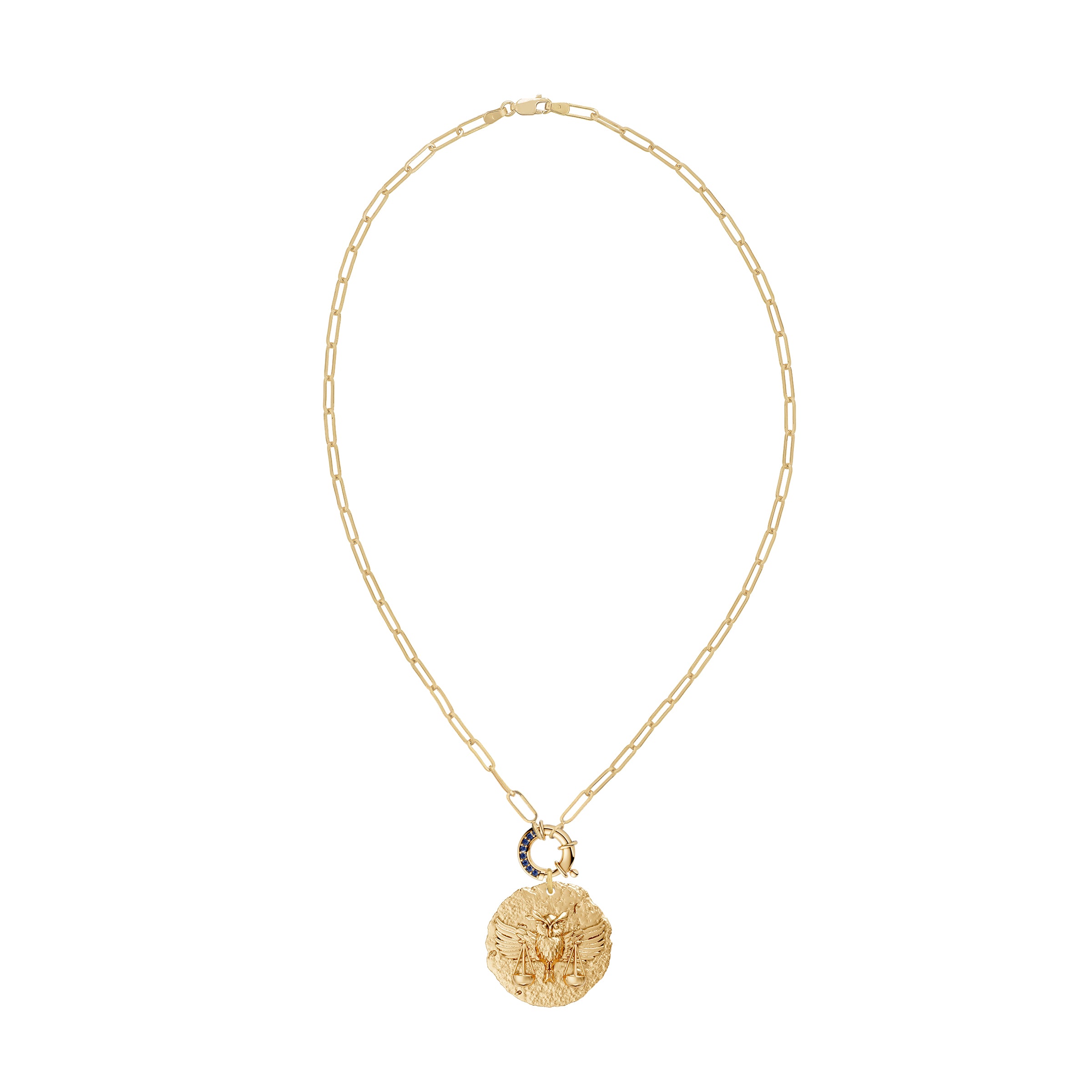 Gold necklace with a round zodiac libra pendant on link chain with decorative blue sapphire clasp on a white background