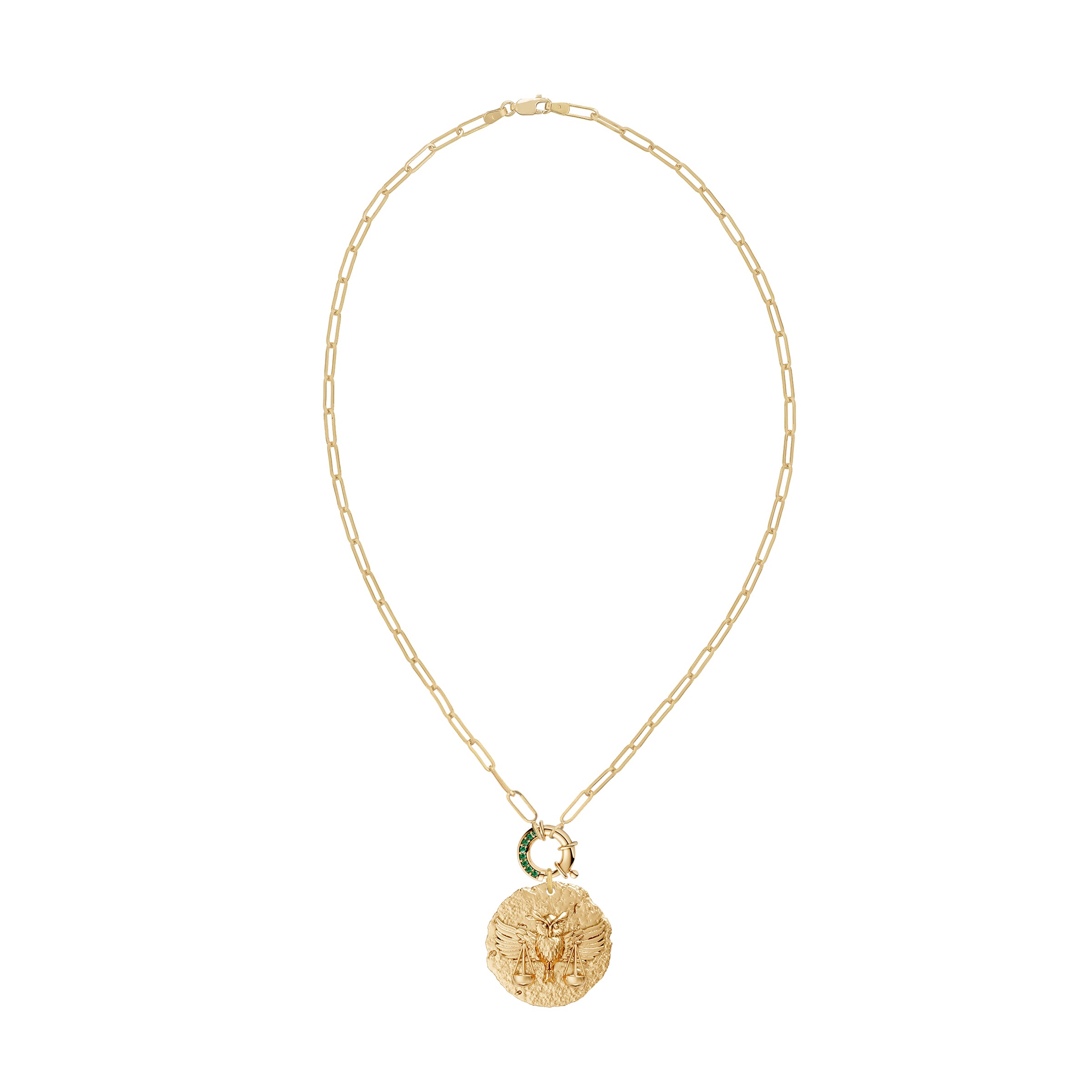 Gold necklace with a round zodiac libra pendant on link chain with decorative emerald clasp on a white background
