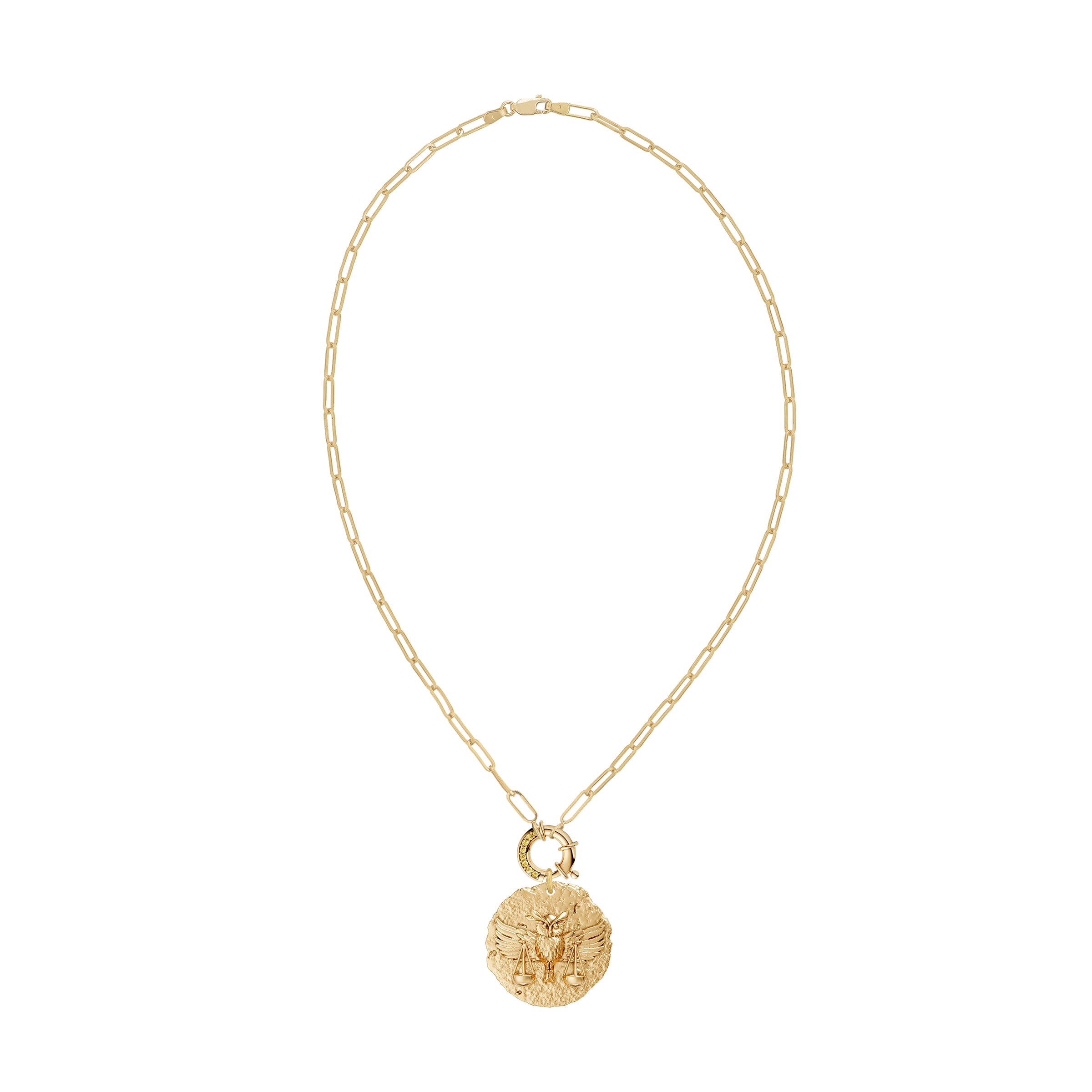 Gold necklace with a round zodiac libra pendant on link chain with decorative yellow diamond clasp on a white background