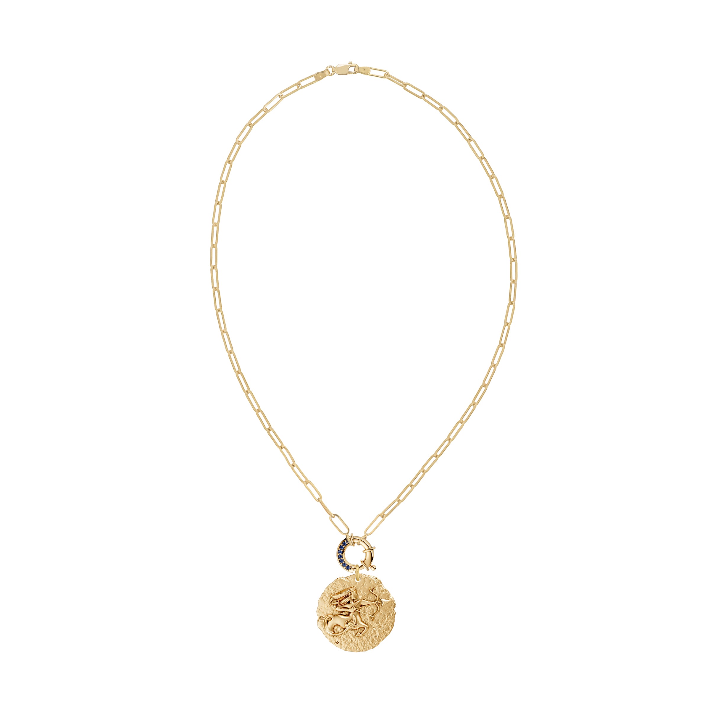 Gold necklace with a circular zodiac Sagittarius pendant on a paperclip link chain and a blue sapphire clasp on a white background