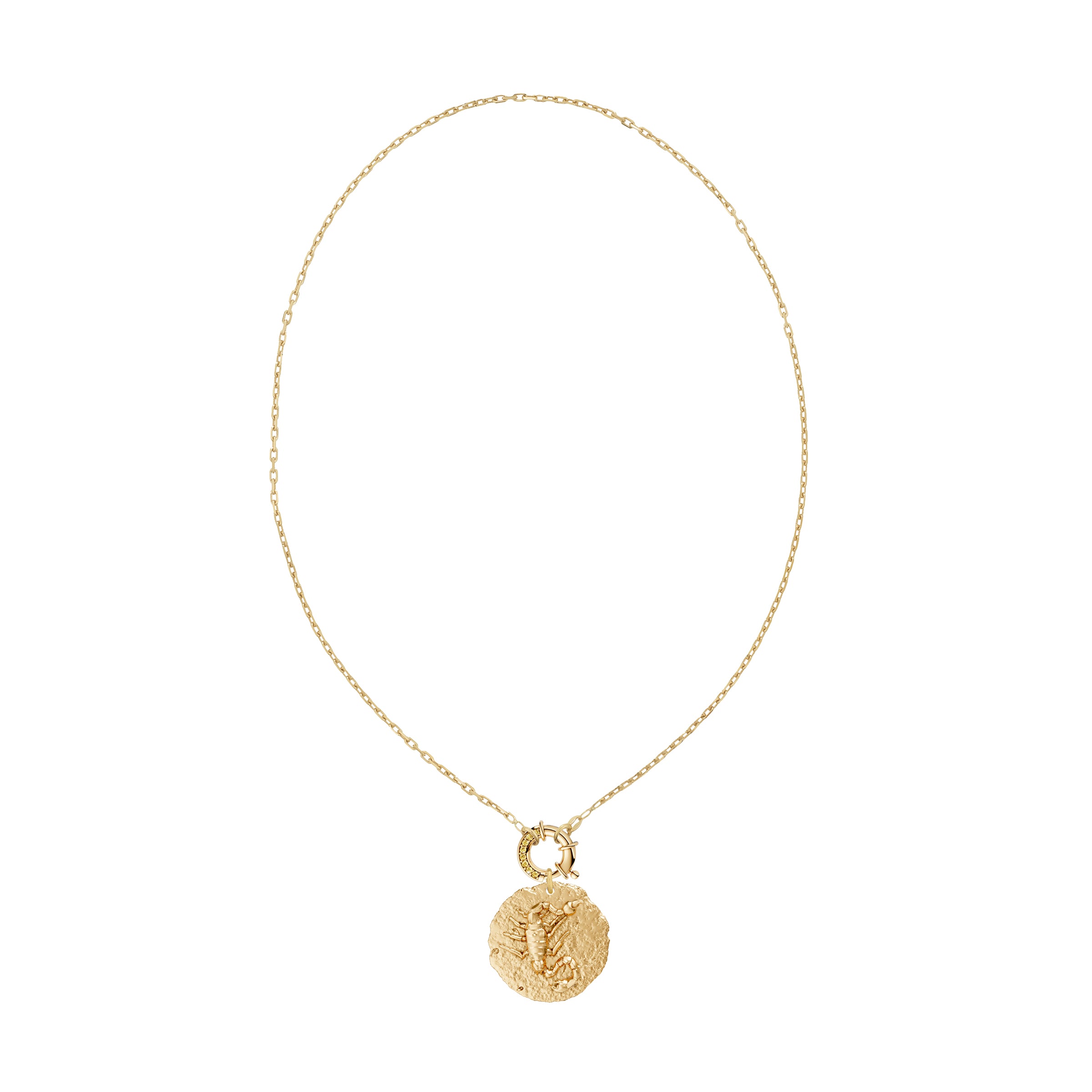 Gold necklace with a circular zodiac scorpio pendant on small link chain and yellow diamond clasp on a white background