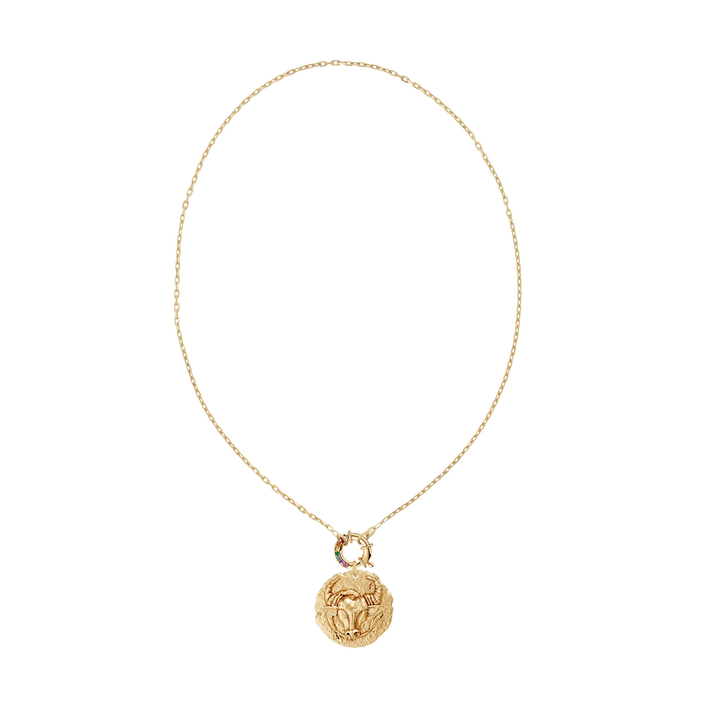 Gold necklace with a taurus zodiac  pendant and a rainbow sapphire decorative clasp on a white background