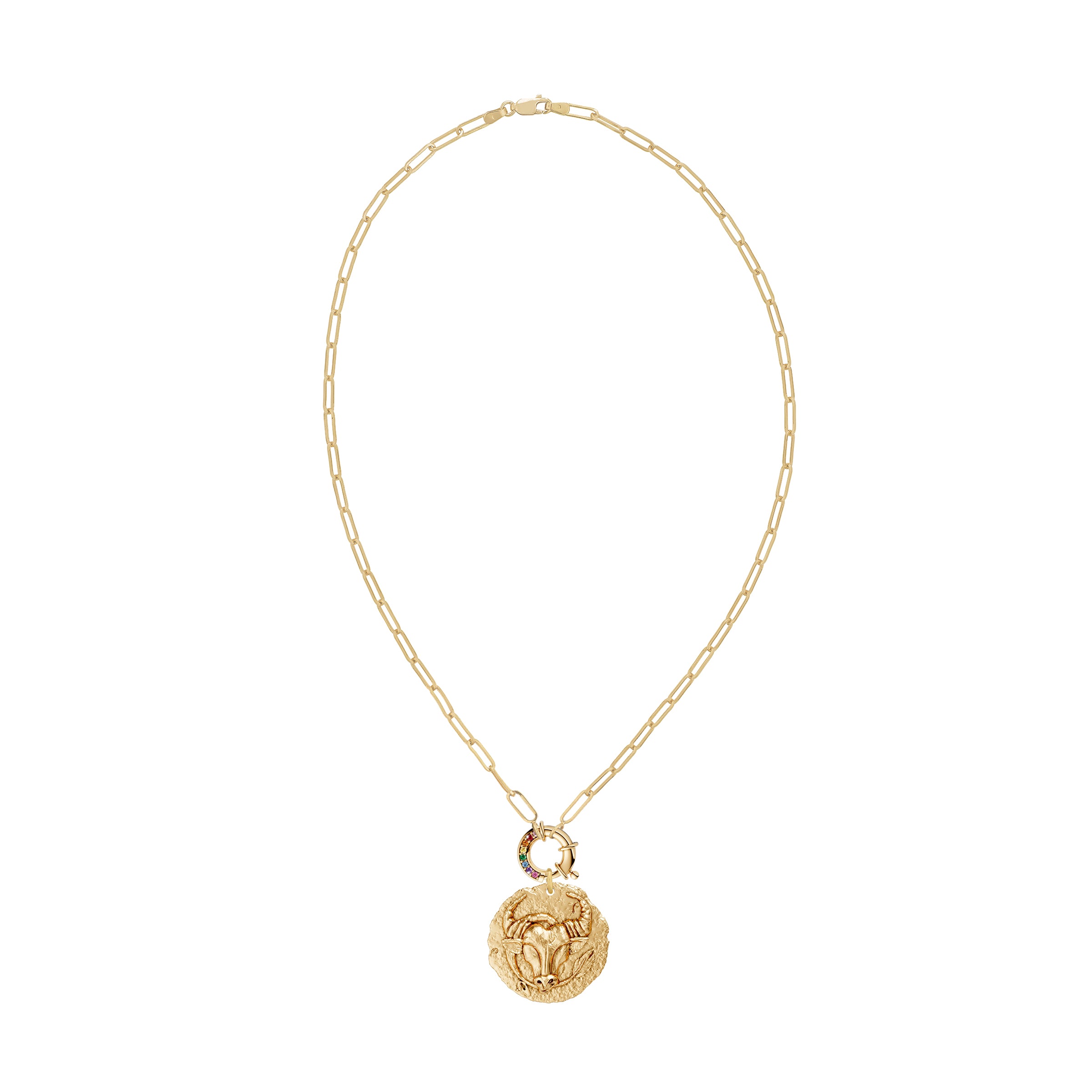 Gold necklace with a taurus zodiac  pendant and a rainbow sapphire decorative clasp on a white background
