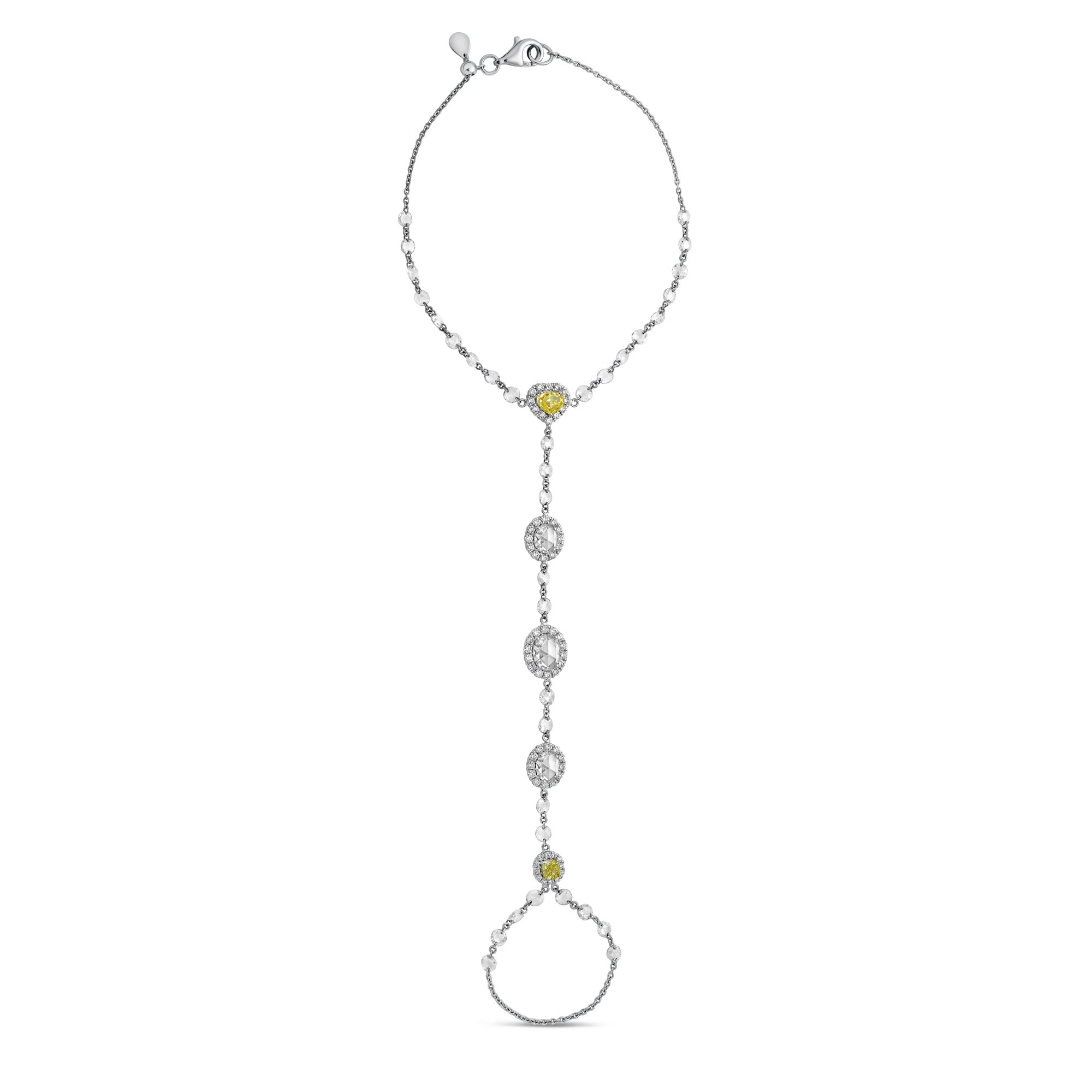 18k gold hand chain connecting wrist to finger, featuring rose-cut diamonds accented with yellow diamonds along the center chain.