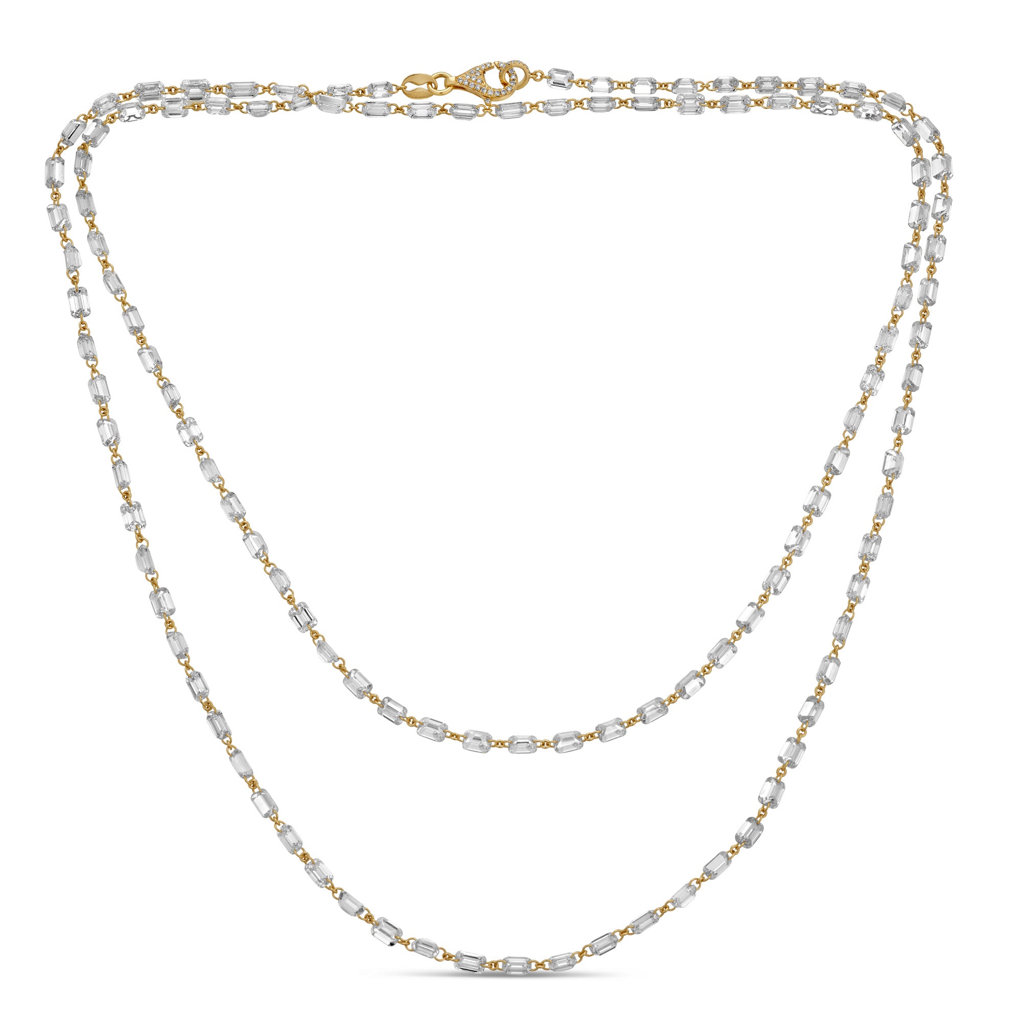 18k gold station necklace featuring baguette-cut diamonds evenly spaced along the chain, shown in a double strand style.