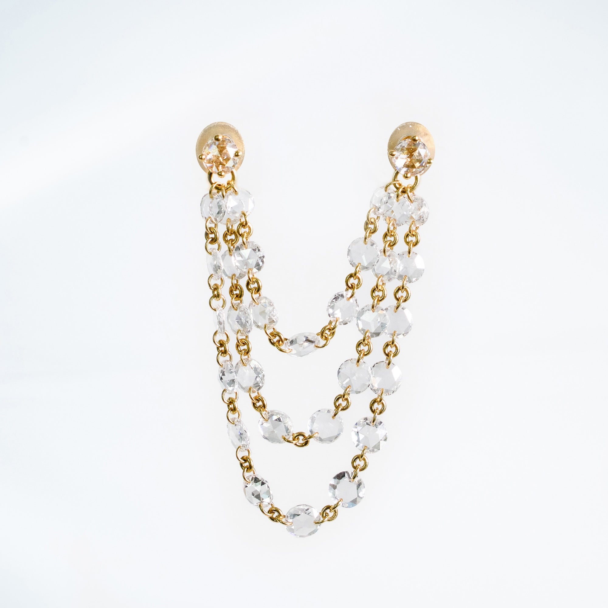 Single 18k yellow gold dangle 3 strand earrings.  Rose cut natural mined diamonds on chain to create a drapping effect. 