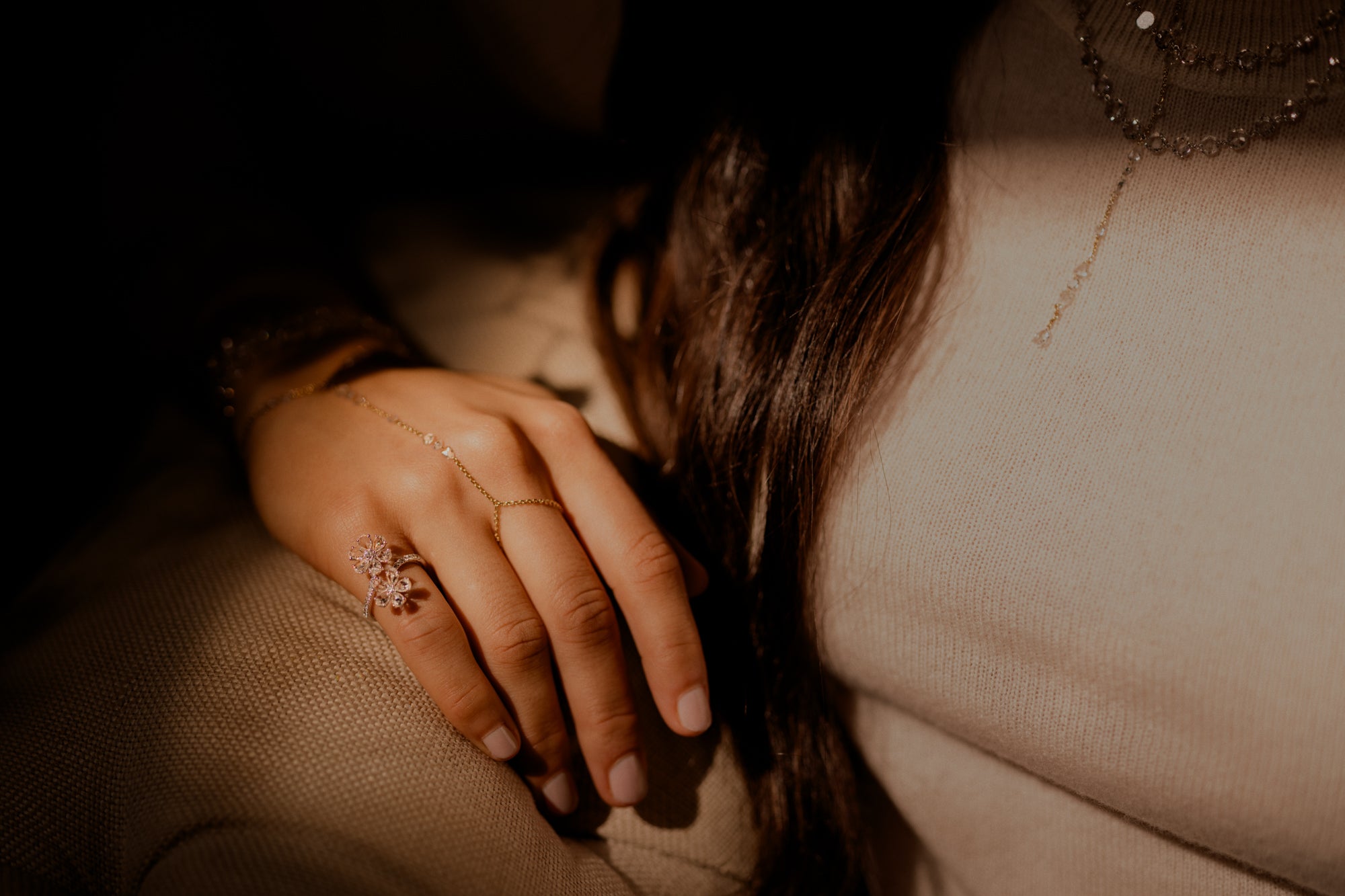 Woman wearing rose cut diamond flower ring, rose cut diamond hand chain set in 14k gold.  1 lariat necklace rose cut diamonds set in 14k yellow gold