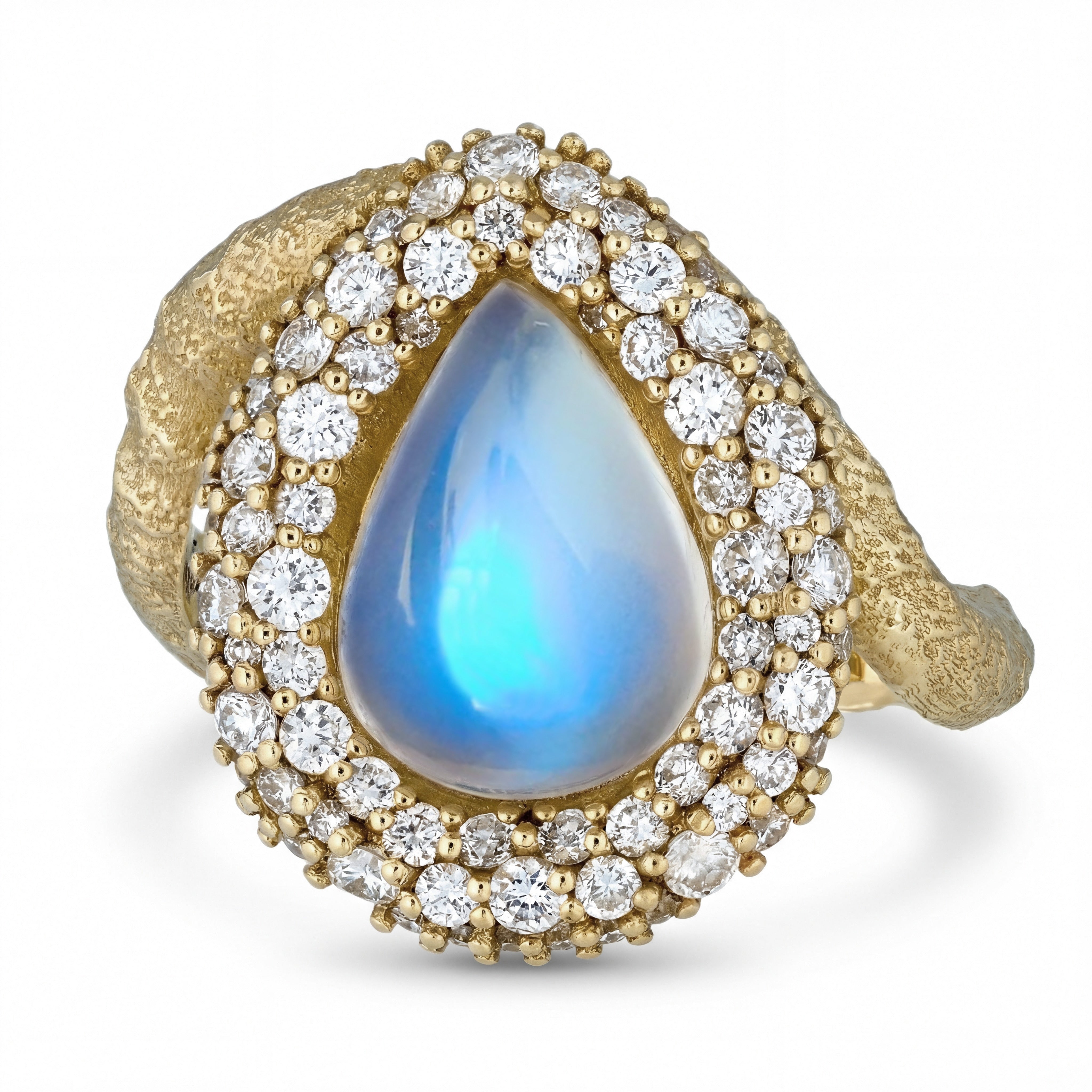 Gold ring with a teardrop-shaped blue sheen moonstone and diamond accents on a white background. 